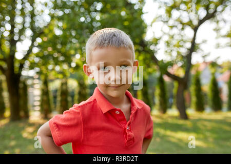 Portrait of content boy in garden Stock Photo