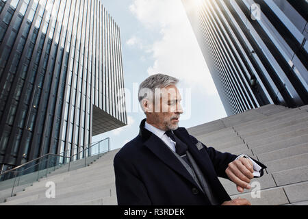 Businessman checking the time Stock Photo