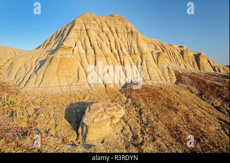 Canada, Saskatchewan, Avonlea. Arid badland clay formations at sunrise. Stock Photo