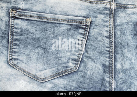 Acid washed jeans with a pocket texture of denim Stock Photo