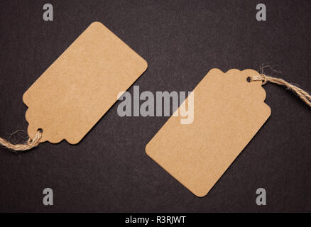 Close-up, two price tags on black background Stock Photo