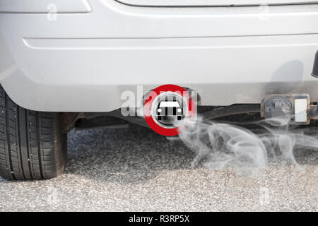 Exhaust from a car with the traffic sign for driving ban, in german Fahrverbot for diesel motor vehicles in the low emission zone of some cities of Ge Stock Photo