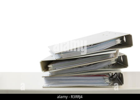 stack of folders on a desk isolated on a white background, business and finance concept, copy space Stock Photo