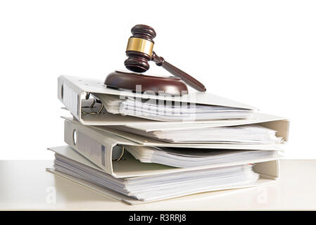 stack of folders and a judge gavel on a desk, isolated on a white background, concept for justice, business and finance, copy space, selected focus, n Stock Photo