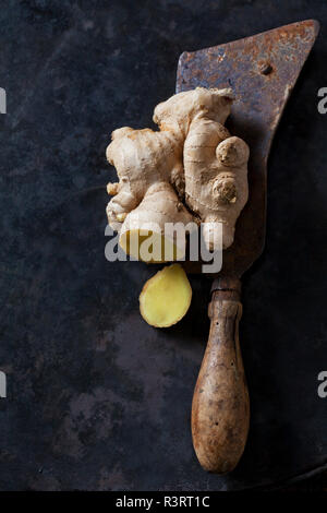 Sliced ginger root on an old knife Stock Photo