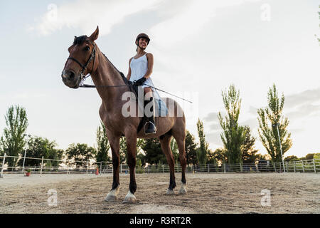 Smiling woman on horse Stock Photo