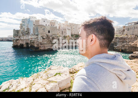 Italy, Puglia, Polognano a Mare, man looking at view Stock Photo