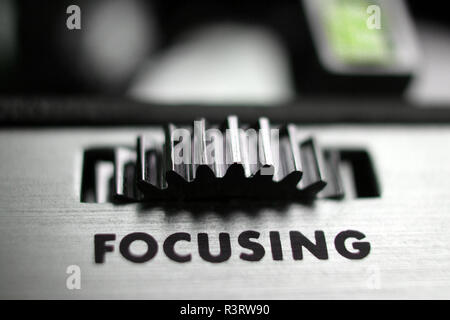 Close up of word focusing on a vintage electronic device focus adjuster Stock Photo