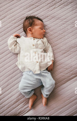 Newborn baby boy sleeping on a blanket Stock Photo