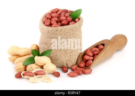 peanuts with leaf in bag isolated on white background Stock Photo