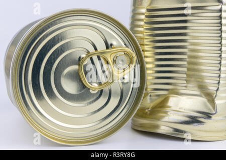 Can with meat dish on a white table. Canned food with a long shelf life. Light background. Stock Photo