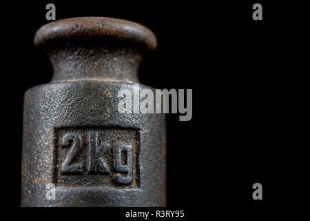 Vintage 5 kilograms calibration iron weight Stock Photo - Alamy