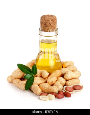 peanut oil in a glass bottle with peanuts Stock Photo