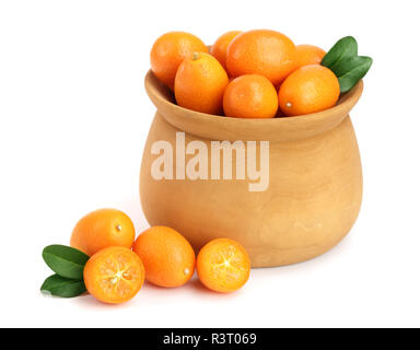 Cumquat or kumquat with leaf in wooden bowl isolated on white background close up Stock Photo