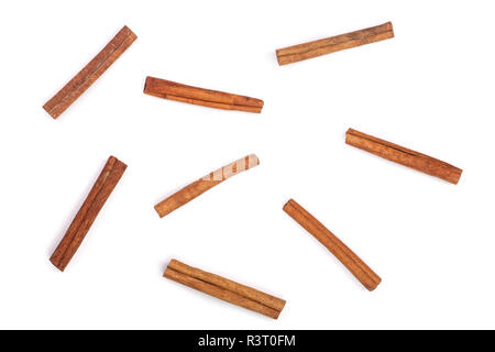 Cinnamon sticks isolated on white background, top view. Flat lay pattern Stock Photo