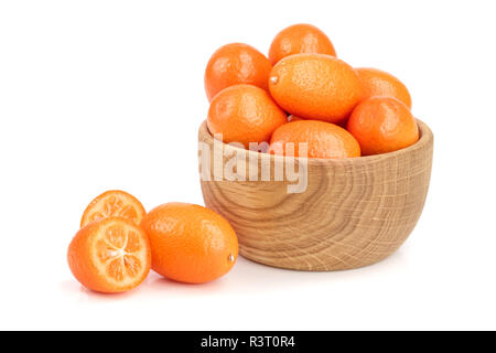 Cumquat or kumquat in wooden bowl isolated on white background close up Stock Photo