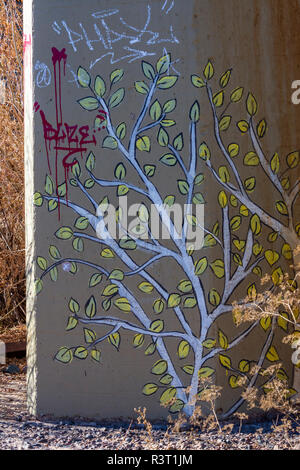 Colorful painting of Aspen trees on concrete bridge support of railroad bridge defaced by graffiti. Castle Rock Colorado US. Photo taken in November. Stock Photo