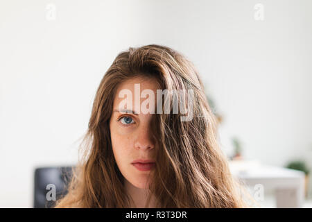 Portrait of brunette young woman at home Stock Photo