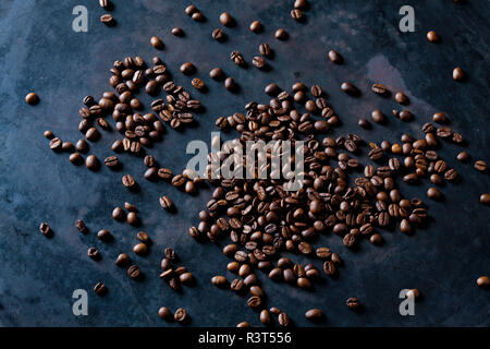 Freshly roasted coffee beans on dark background Stock Photo