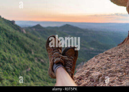 Spain, Barcelona, Montserrat, feet of resting man Stock Photo