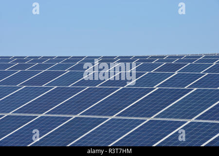 Germany, View of large number of solar panels at solar plant field