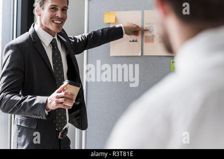 Two colleagues working on project in office Stock Photo