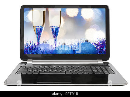 blue baubles and glasses on screen of laptop Stock Photo
