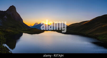 Germany, Bavaria, Allgaeu, Allgaeu Alps, Lake Rappensee, Kleiner Rappenkopf at sunset Stock Photo