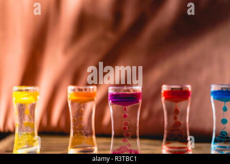 Toy with water and drops of oil colors. Stock Photo