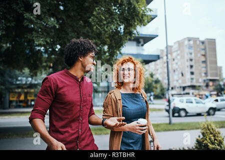 Colleagues walking in the city, talking Stock Photo