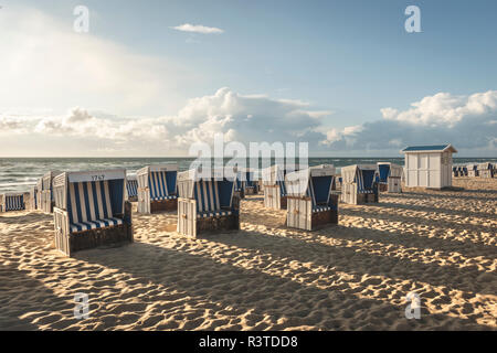 Germany, Schleswig-Holstein, Sylt, Westerland, hooded beach chairs on beach Stock Photo