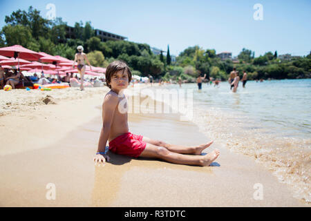 Portrait of a boy sitting on the beach