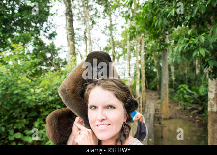 Woolly Monkey and Woman Stock Photo