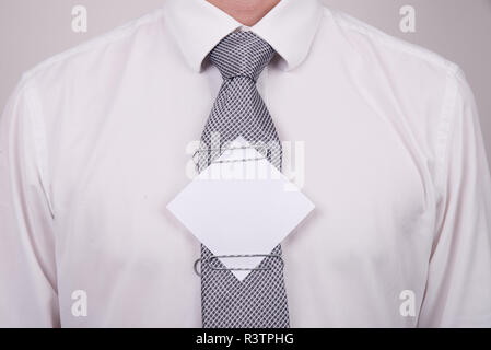 Office worker with note on tie Stock Photo