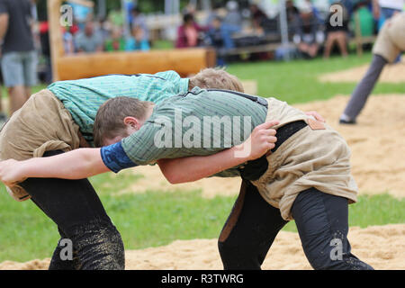 Two teenagers in Swiss National Sport of Pants Lifting or Swiss Wrestling Stock Photo