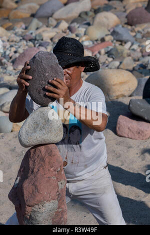 Mexico, State of Jalisco, Puerto Vallarta. El Centro, old downtown. View of 'stone stackers' who balance beach rocks for tips. Stock Photo