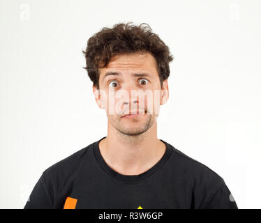 Portrait of nice young boy raising eyebrow Stock Photo