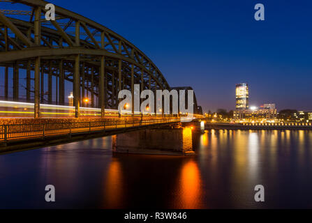 View of the Hohenzollernbridge, the Cologne Triangle, the Hyatt Regency and  the River Rhine at Night in Germany Cologne 2018. Stock Photo