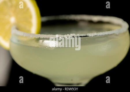 Margarita Cocktail with tequila, lime juice and cointreau with isolated black background Stock Photo