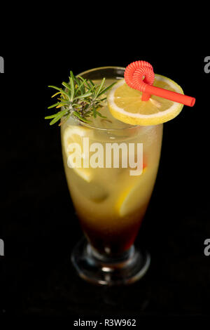 Long Island cocktail with vodka, tequila, rum, cin and lime juice with isolated black background Stock Photo