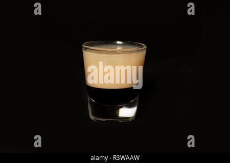 B52 cocktail with kahlua, baileys and cointreau with isolated black background Stock Photo