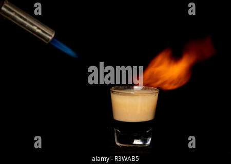 B52 cocktail with kahlua, baileys and cointreau with isolated black background Stock Photo