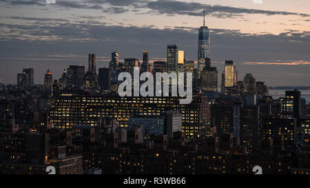Lights come up as sun goes down in Lower Manhattan. Stock Photo
