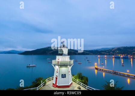 New Zealand, South Island, Canterbury, Banks Peninsula, Akaroa Lighthouse at Dusk Stock Photo