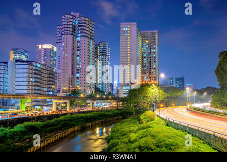 KUALA LUMPUR, MALAYSIA - JULY 28: This is a view of high rise riverside apartment buildings in the downtown area at night on July 28, 2018 in Kuala Lu Stock Photo