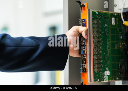 Fix network switch in data center room Stock Photo