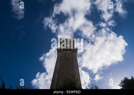 Feeling small while looking up at the Baroque style clock tower located in Mtarfa, Malta. Stock Photo