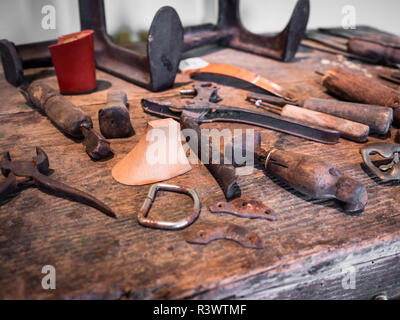 Detail of the wooden counter of a shoemaker. Stock Photo