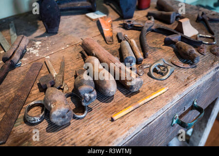Detail of the wooden counter of a shoemaker. Stock Photo