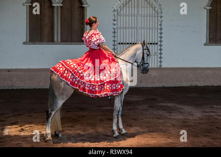 Central America, Costa Rica, Rancho San Miguel. Traditional Andalusian horse show, female rider in typical Spanish attire. (Editorial Use Only) Stock Photo